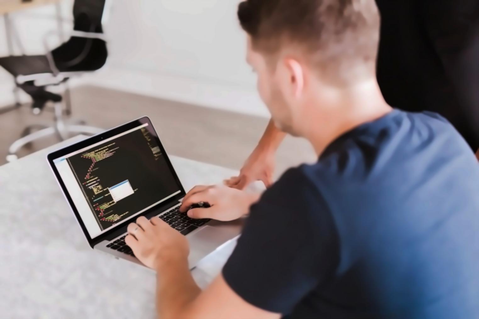 Mobile game development workspace showing design sketches and development tools
